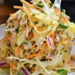 Old-fashioned sauerkraut salad in a bowl with fresh vegetables