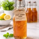Homemade fizzy probiotic soda in glass bottles