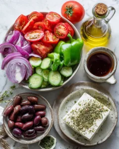 Fresh ingredients for a greek salad recipe arranged on a board
