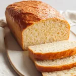 Sliced 4 ingredient carnivore bread loaf on a plate