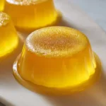 gelatin weight loss recipe served in a clear glass with lemon and honey on a light surface
