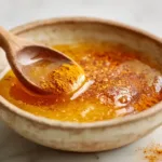 Honey trick recipe ingredients in a ceramic bowl with raw honey, cinnamon, and turmeric